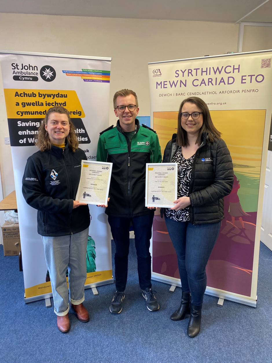 James Cordell, St John Ambulance Cymru’s Deputy Commissioner for Dyfed is pictured with Hannah Boyd, Pembrokeshire Coast National Park Authority Decarbonisation Officer and Lauren Williams, PR & Communications Officer for the Port of Milford Haven.